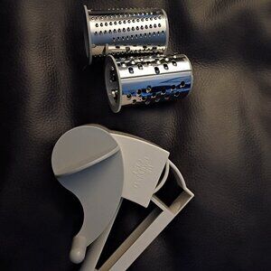 Pampered chef rotary cheese grater with both barrels, left or right handed